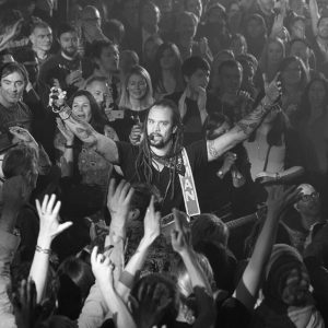 Michael Franti performing from the crowd at his gig in London in 2016