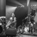 NOFX and their old and new gig backdrops performing in London in 2012 and 2015.